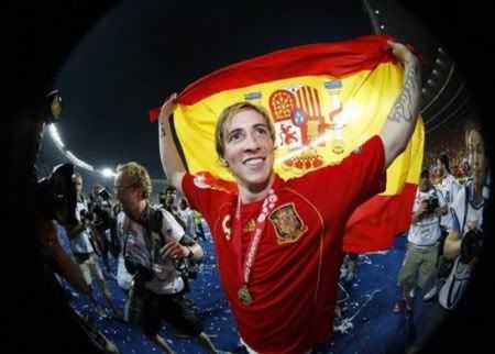 Spain's Fernando Torres holds a national flag as he celebrates his side's 1-0 win at the end of the Euro 2008 final between Germany and Spain in the Ernst-Happel stadium in Vienna, Austria, Sunday, June 29, 2008, the last day of the European Soccer Championships in Austria and Switzerland. (AP Photo by Jon Super)