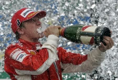 FORMULA 1 - Ferrari Formula One driver Kimi Raikkonen of Finland celebrates on the podium after winning the Brazilian Grand Prix at the Interlagos racetrack in Sao Paulo October 21, 2007.  Raikkonen secured his first Formula One title by a single point on Sunday after a stirring victory in Brazil. His unexpected title triumph ended 22-year-old Briton Lewis Hamilton’s dreams of becoming the youngest champion in his debut season with McLaren.  REUTERS/Paulo Whitaker (BRAZIL)