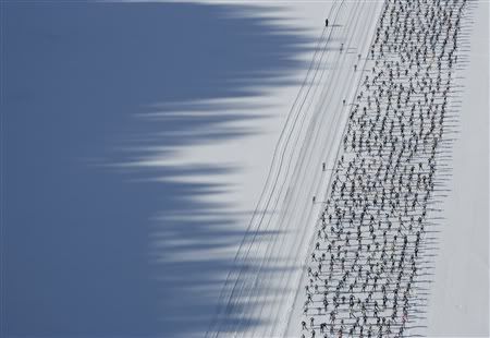 SKIING Cross Country - An aerial view shows cross country skiers racing over the frozen lake Sils during the Engadin Ski Marathon near Sils March 11, 2007. More than 9,500 skiers participated in the 42.2 km race between Maloja and S-Chanf near the Swiss mountain resort of St. Moritz. REUTERS/Stefan Wermuth