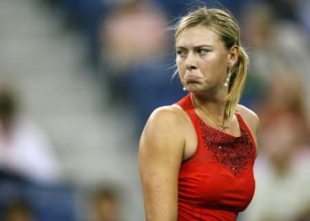 TENNIS - Maria Sharapova of Russia reacts during her match against Casey Dellacqua of Australia at the U.S. Open tennis tournament in Flushing Meadows, New York, August 30, 2007. REUTERS/Jeff Zelevansky (UNITED STATES)